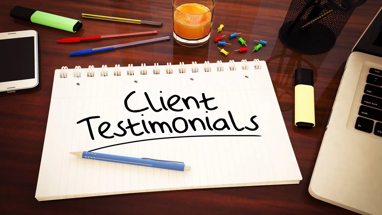 client testimonials written on a jotter