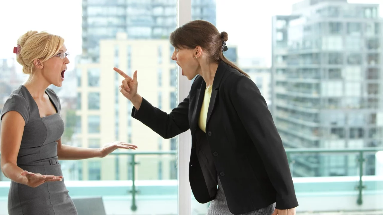 Two angry women having an argument, one pointing her finger at the other - Anger Management